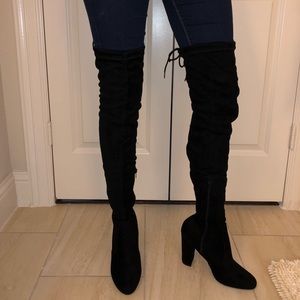 Over the knee black thigh boots